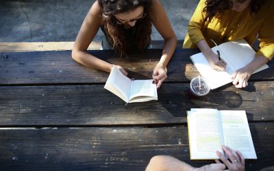 Photo of women reading at a book club for First Chapter article