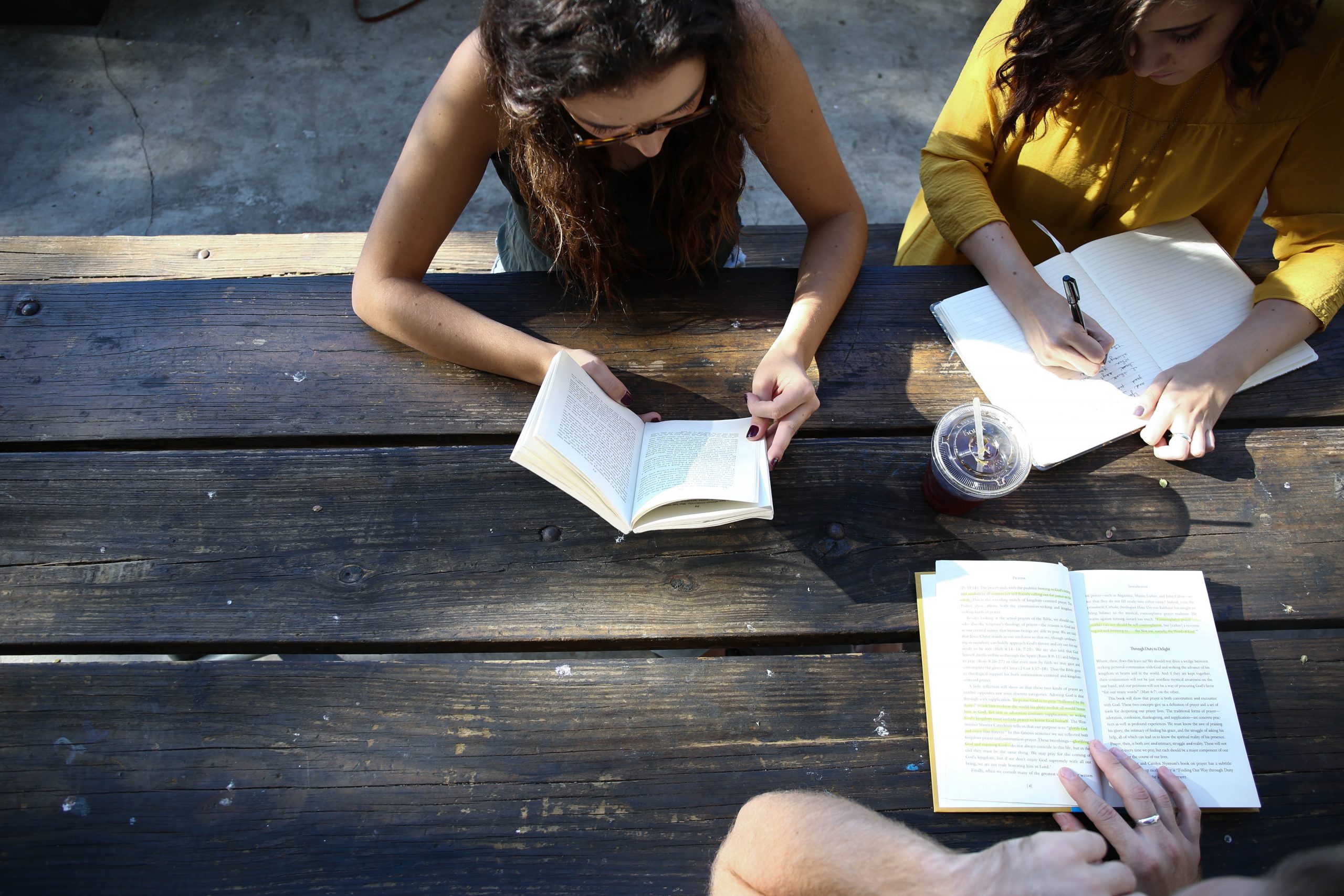 Photo of women reading at a book club for First Chapter article